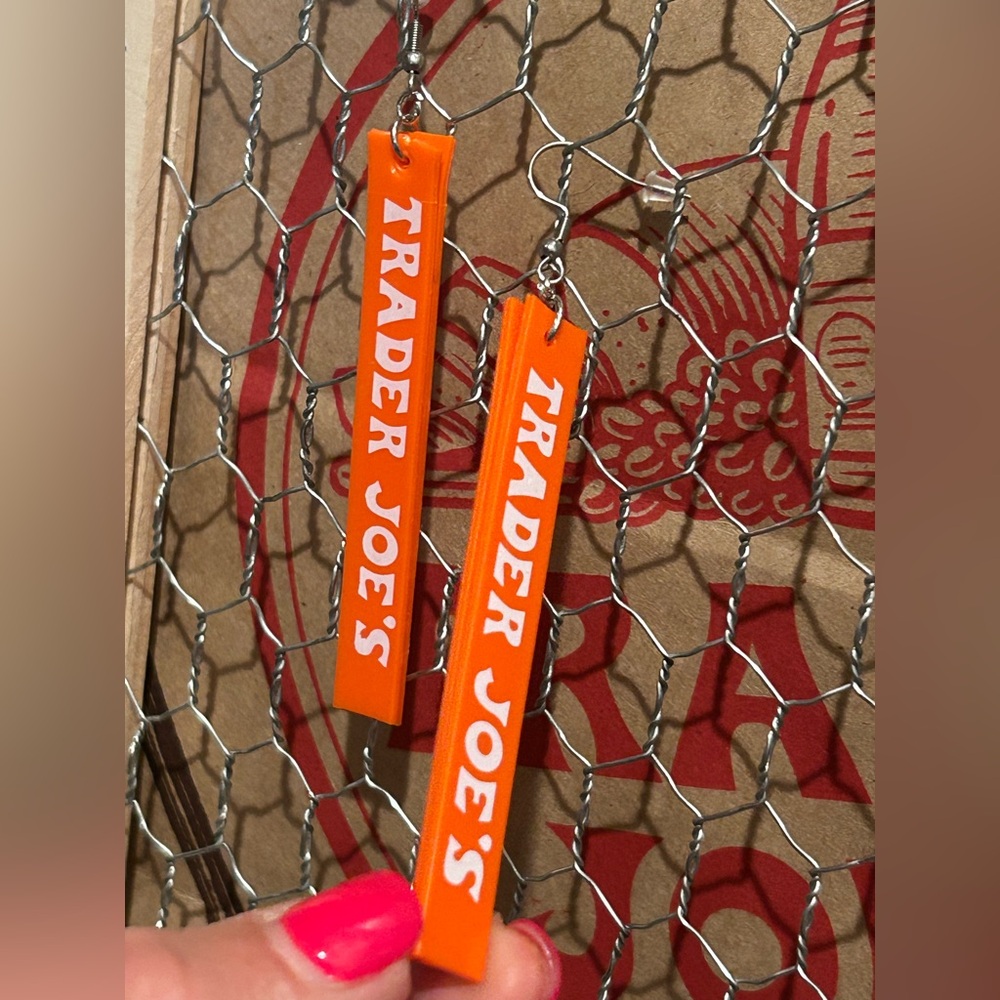 Trader Joe’s earrings double sided orange with white lettering